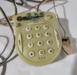 Bell Equipment Sonecor Mini Telephone DS-50 Sparkling Green Belt Clip Headset. Fixed Price $7.99.