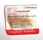 Radio Shack #279-299 Telephone Handset Cord Untangler Ivory New. Fixed Price $5.00.