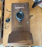 Western Electric Wall Mount Hand Crank Telephone W/ Push To Talk Headset. Fixed Price $125.00.